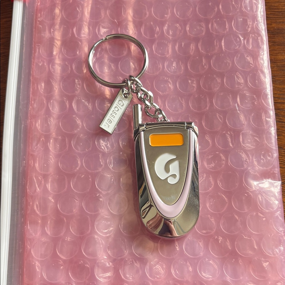 Glossier Silver Keychain Card Holder with Pink and Orange Accents